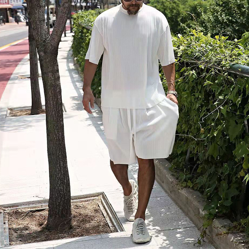 2022 estación independiente de verano europeo y americano rayas verticales de los hombres traje suelto pantalones cortos de manga corta de color sólido traje deportivo casual