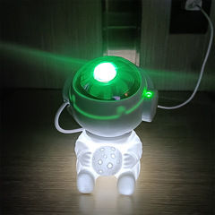 Cross-border astronaut sitting posture starry sky projection lamp full of stars laser romantic atmosphere lamp bedroom space man night light