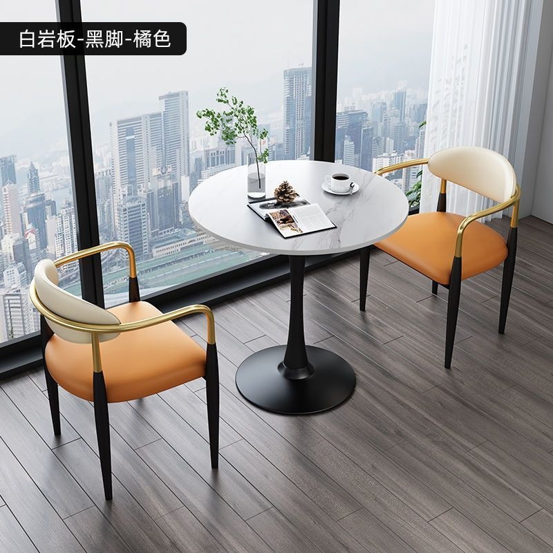 Black legs + white rock slab + orange leather, one table and two chairs