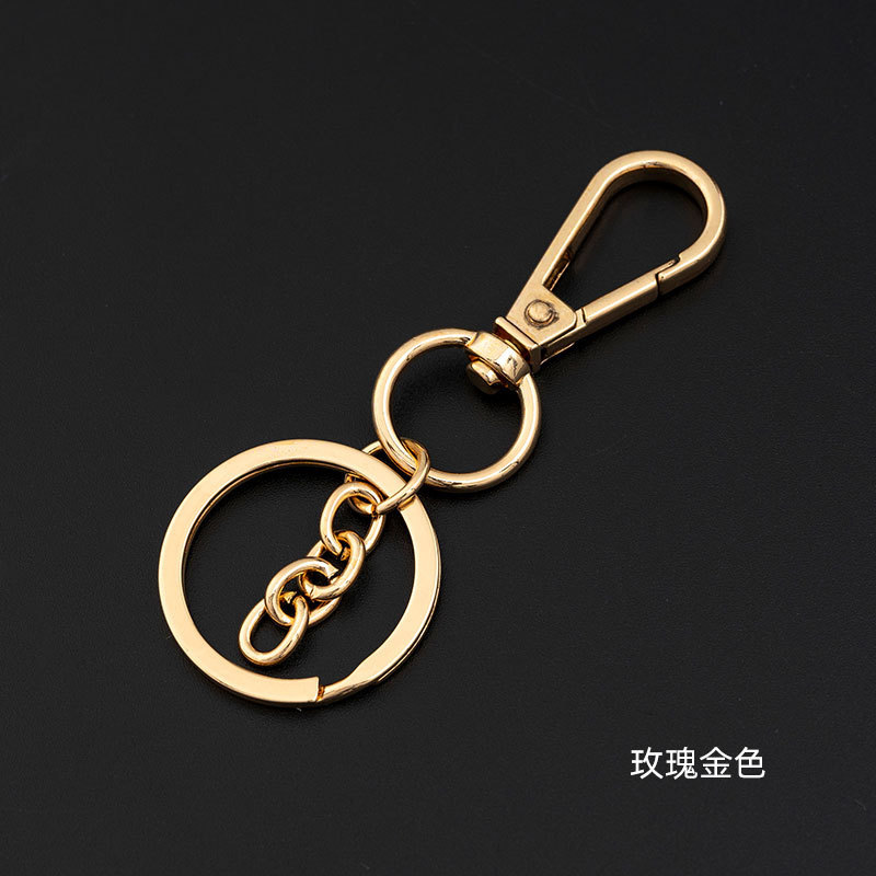 バラの金の犬のボタンのキーホルダーは金属のキーホルダーのチェーンの8字を掛けてdiyの金属のアクセサリの部品の掛け物の材料を掛けます。|undefined