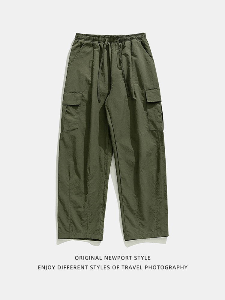 Textura ligeramente arrugada, pantalones de herramientas funcionales antisalpicaduras, estilo de primavera para hombres, pantalones casuales con cordón plisado suelto al aire libre japonés