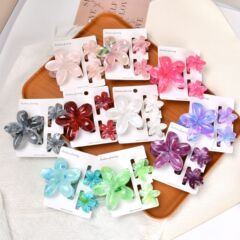 国境を越えたヨーロッパとアメリカの売れ筋の2色のプルメリアヘアピンセット、女性用のバウヒニウムフラワーグリッパー、休暇後の後頭部のシャーククリップ
