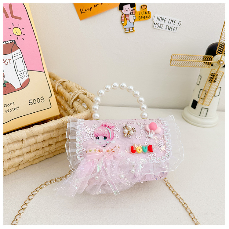 Primavera y verano nuevos bolsos infantiles, bolsos de perlas de arco, bolsos de mano, princesa de estilo extranjero, bolsos de cambio de hombro