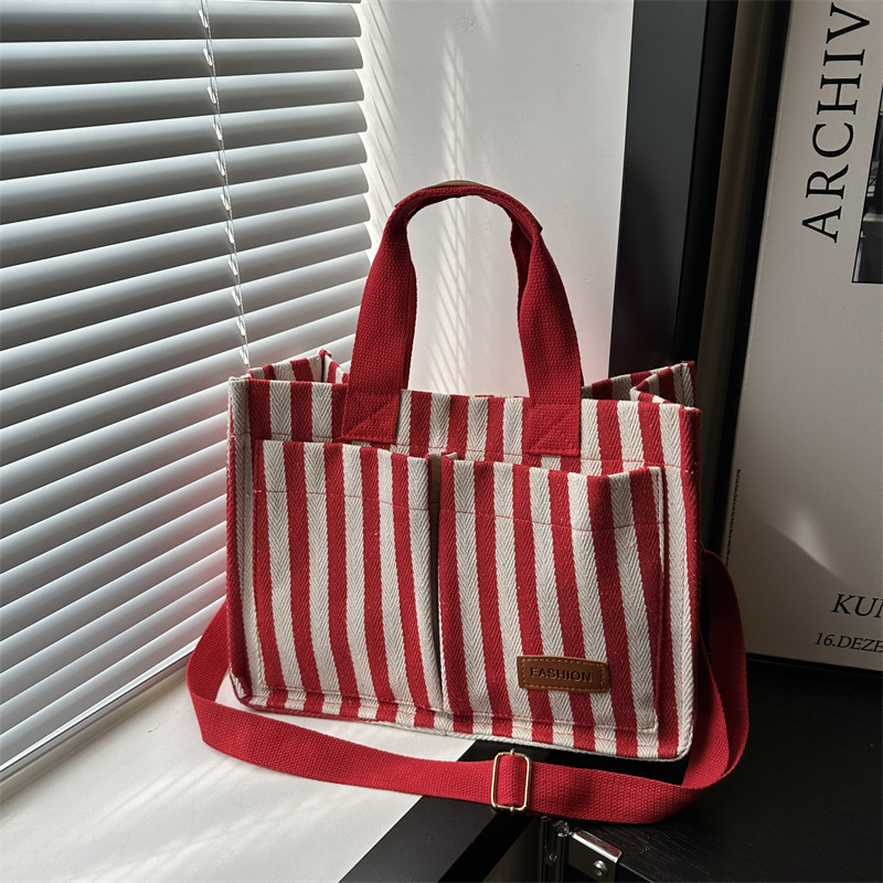 Bolsas de gran capacidad de transporte 2024 nuevas bolsas de mujer populares bolsas de lona a rayas bolsas de mochilas de moda bolsas de mano