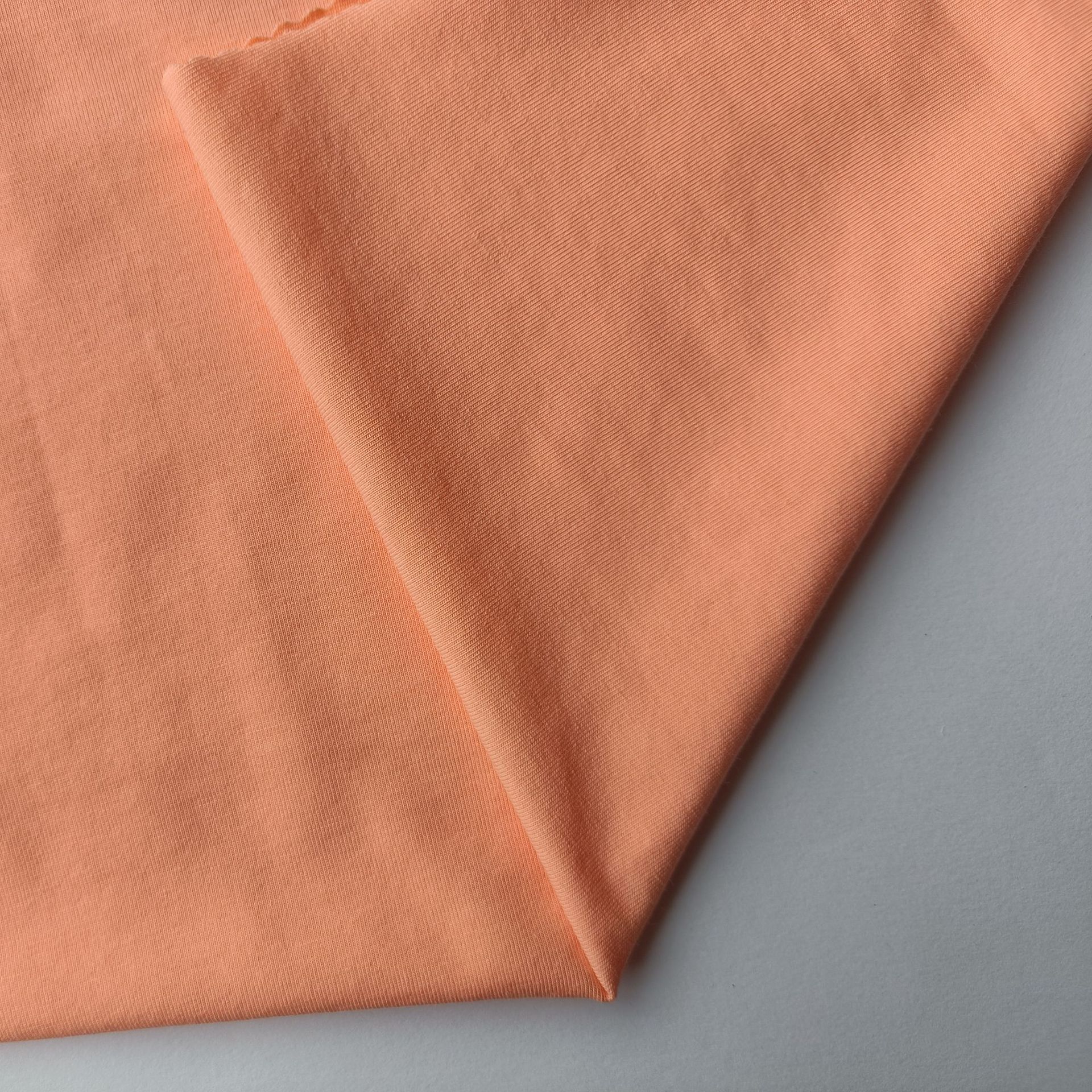 32S棉氨纶蚀毛针织单面汗布  全棉拉架蚀毛汗布  时装面料供应