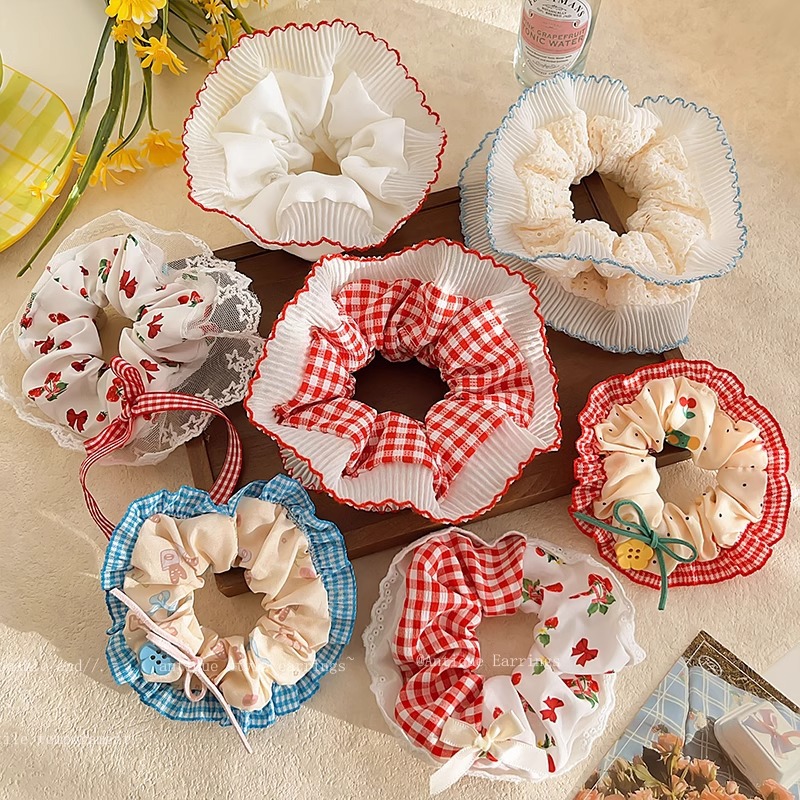 Pastoral viento intestino anillo de cabello mujer 2025 nuevo estilo de alta sensación bola de cabello cuerda de cabeza flor dulce princesa adornos de cabello cuerda