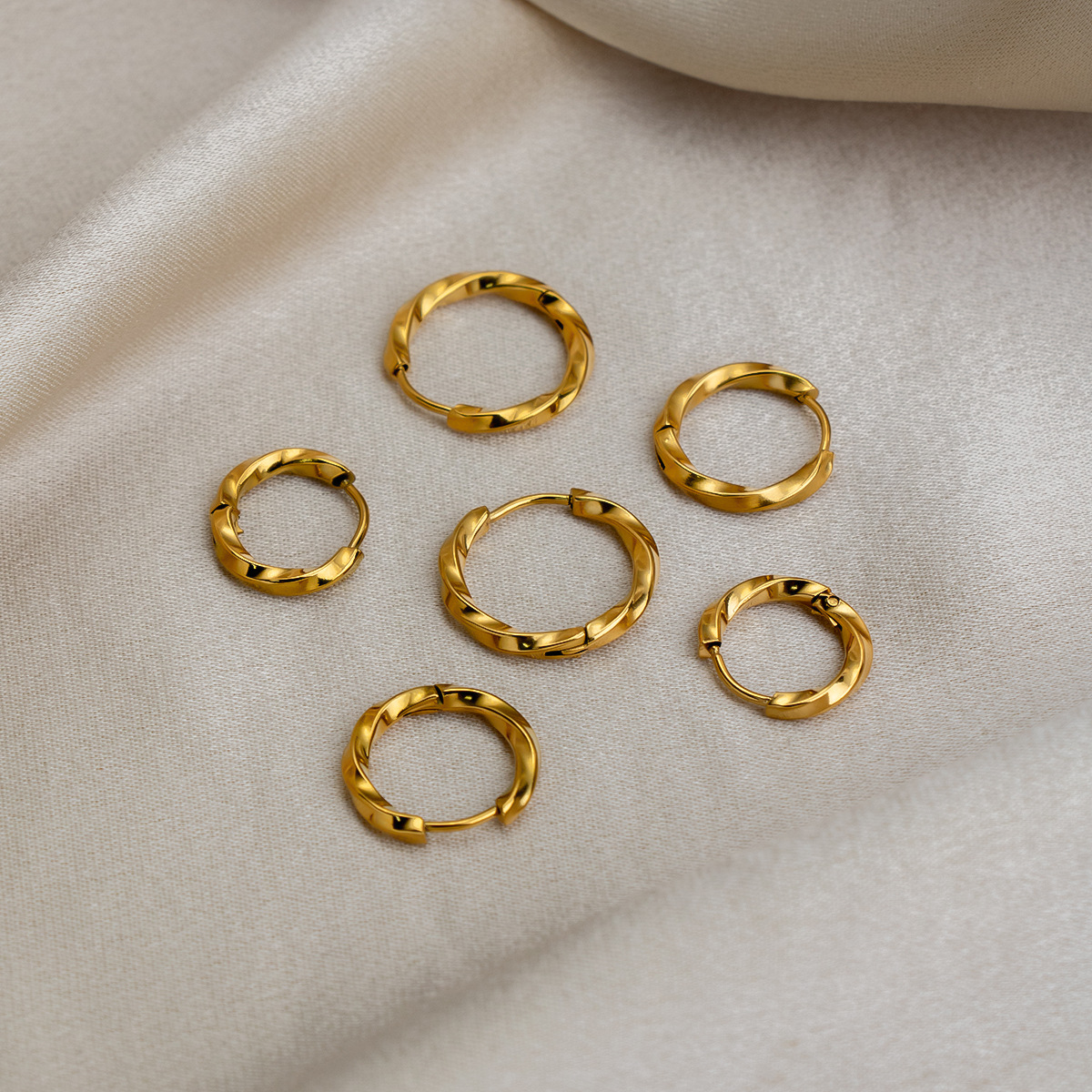 European and American Fashion Stainless Steel Simple Luxury Twist Hoop Earrings Autumn and Winter High-End Plain Hoop Earrings Jewelry Wholesale
