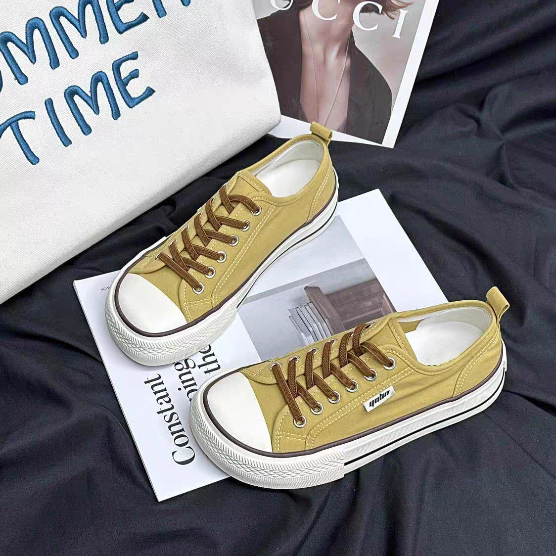 2026 primavera y verano nuevos zapatos de lona de mujer de altura baja con suela gruesa delantera correa de abertura superficial zapatos de lona casuales de estudiantes