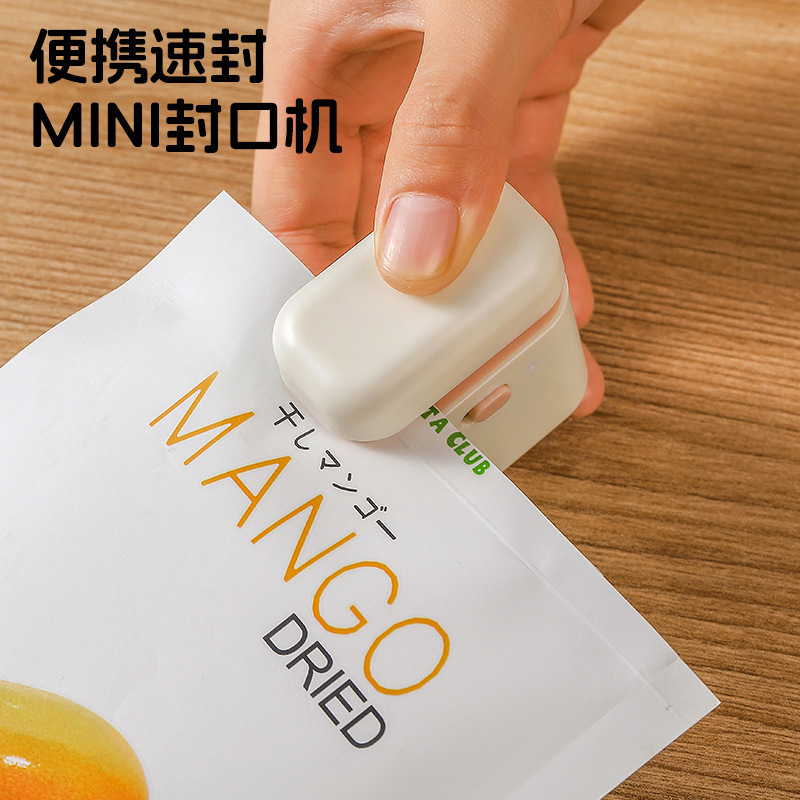 máquina de sellado de bocadillos pequeña máquina de envasado de plástico mini embalaje de bolsas de plástico domésticas de alimentos frescos sellar clip de batería de doble propósito