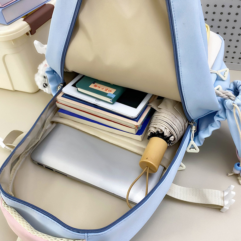 Mochila de tres piezas de estilo nuevo al por mayor para estudiantes de primaria y secundaria, mochila escolar de alto valor y gran capacidad, mochila de viaje de ocio simple