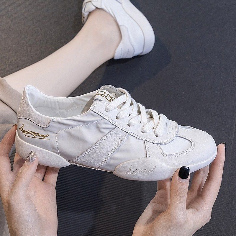 Summer breathable low white sneakers made of soft leather flat