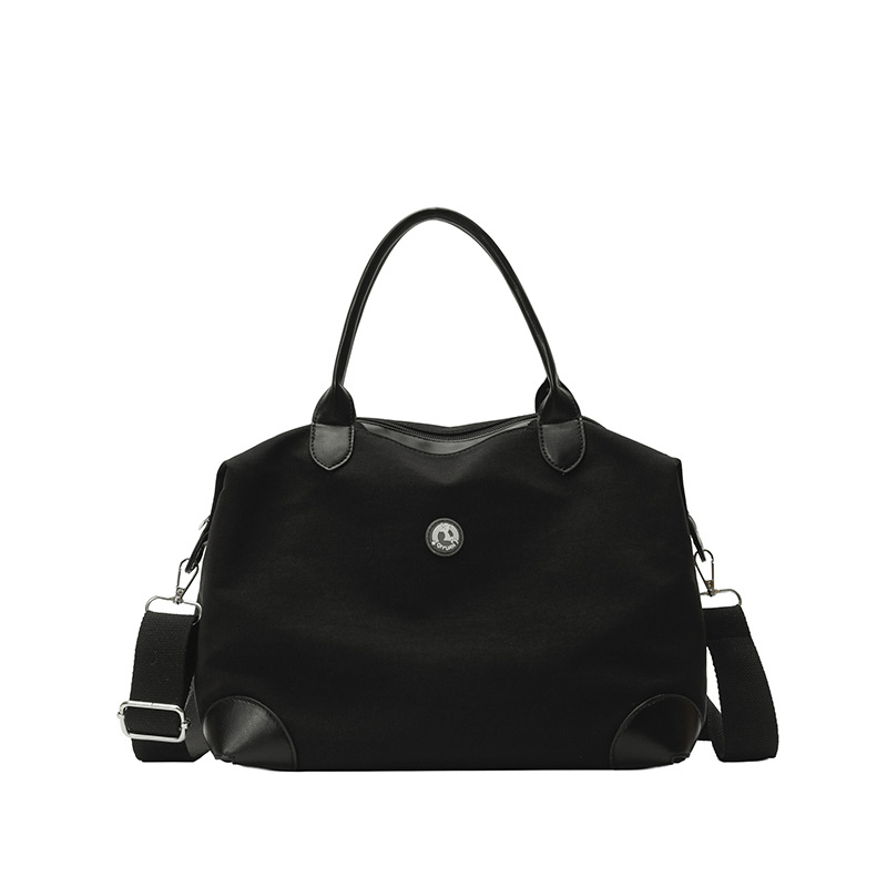 Nueva bolsa coreana para niños, bolsa de viaje ligera de gran capacidad, bolsa de mano casual simple de color sólido para niños y niñas