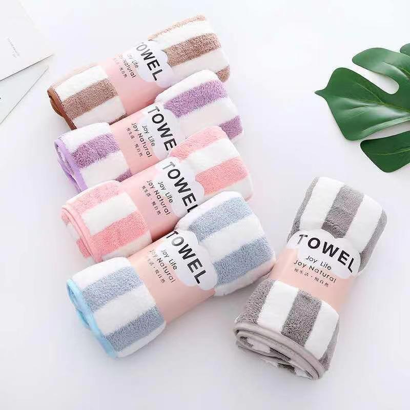 Manufacturer wholesale warp knitted colorful striped coral velvet towel soft absorbent face towel cationic striped floor stall towel