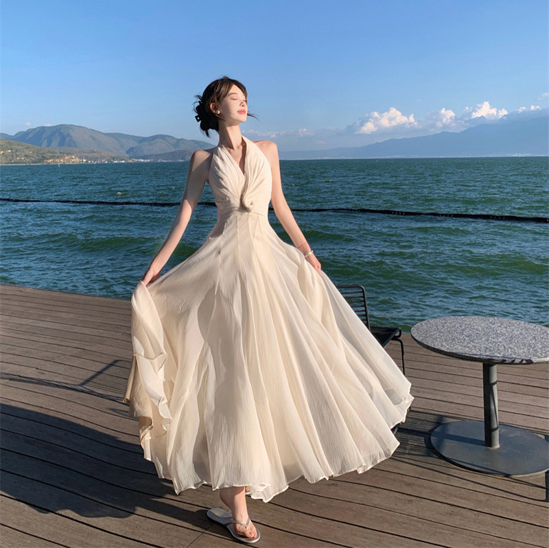 Gentle and Romantic Sleeveless V-Neck Halter Dress with a Stylish Twist, Pleated Waist-Cinching Long Dress for Seaside Vacations