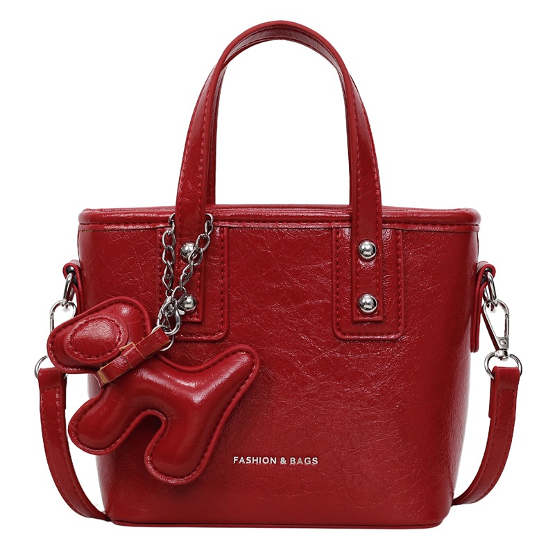 Bolso popular de este año para mujeres 2025, nuevo paquete de cubo de textura transfronteriza de alta calidad, moda versátil bolso de mochila superfuego