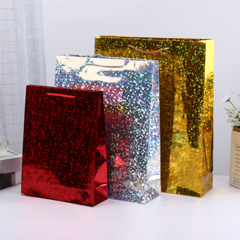 Cool papel de bronce láser bolsas de papel de mano de alta sensación de color láser regalo de cumpleaños bolsa de regalo de vacaciones