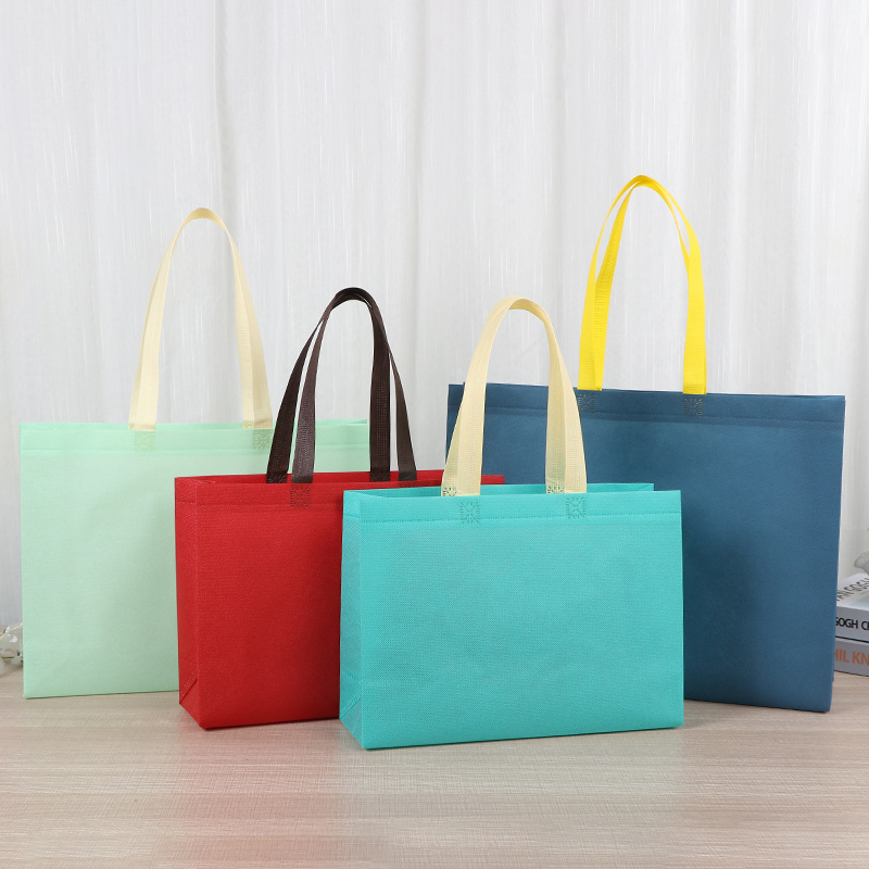 Bolsas de tela no tejida tiendas de souvenirs de viajes de madres y bebés en línea bolsa de compras de mano engrosada bolsa de mano image 1