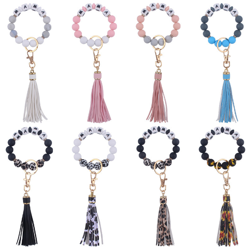 Nuevo cuero pu borla colgante creativo DIY nombre silicona con cuentas leopardo contraste color colgante pulsera llavero