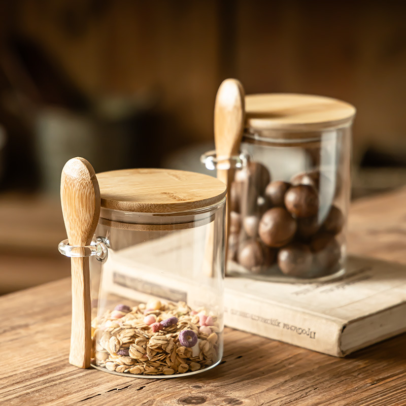 Hogar con cuchara, tanque de almacenamiento, frasco de bocadillos a prueba de humedad, tanque de té, tanque de almacenamiento de cocina transparente con tapa al por mayor