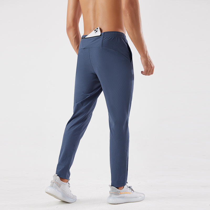 Pantalones deportivos al aire libre Otoño e Invierno hombres corriendo fitness pantalones de secado rápido sueltos transpirables deportes casuales pantalones de entrenamiento de secado rápido
