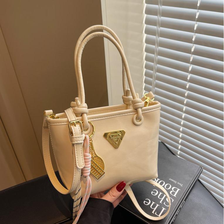 Bolso de mano simple de estilo extranjero para mujeres 2025, nuevo bolso de cubo de alta calidad, bolso de hombro casual simple