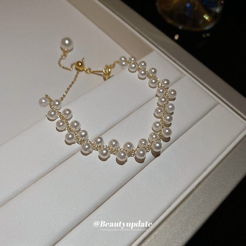 Pulsera tejida de perlas de doble hilera francesa, lujo ligero, pulsera exquisita de moda de alta gama, nueva joyería de todo fósforo, venta al por mayor femenina