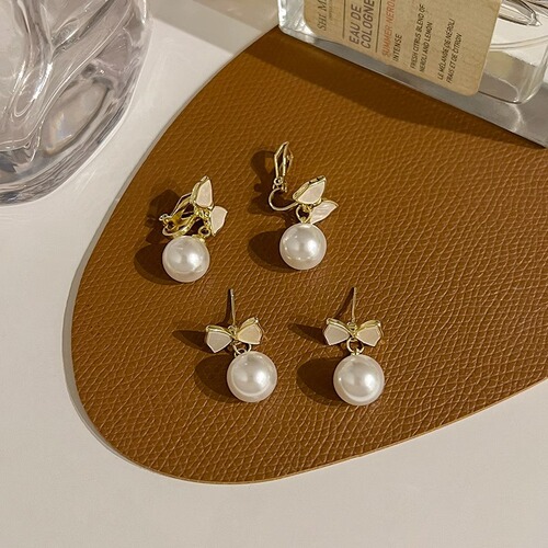 Fashionable butterfly knot pearl earrings for women, new style earrings, niche high-end feel drop earrings, light luxury retro ear clips