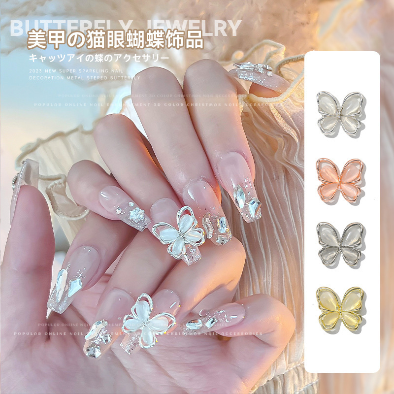 Nueva joyería de diamantes de uñas estilo caliente ojo de gato mariposa tridimensional súper flash ligero lujo hueco rojo de la red portátil armadura accesorios de diamantes grandes