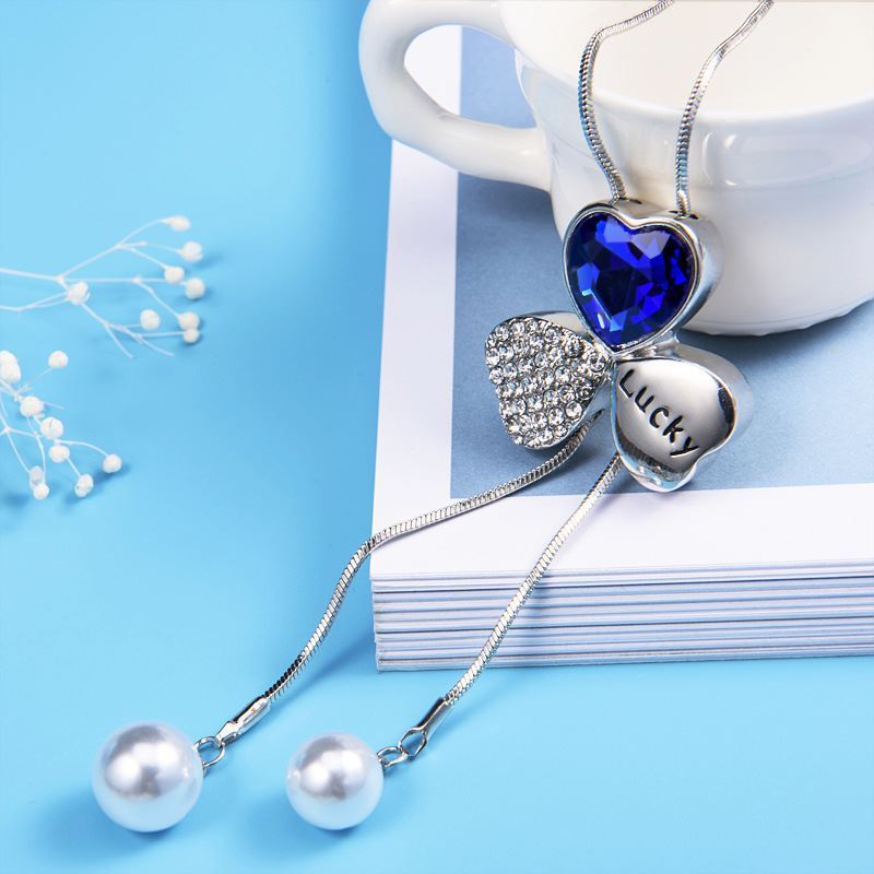 Corea del Sur moda Lucky Clover suéter cadena larga otoño Mujer Todo fósforo suéter colgante flor accesorios collar nuevo