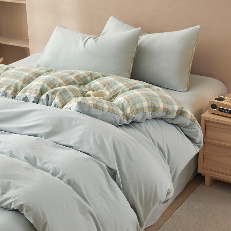 Nuevo traje de cama de algodón lavado de algodón de cuatro piezas de algodón 2025 nuevo traje de dormitorio de funda de edredón de sábana simple de tres piezas