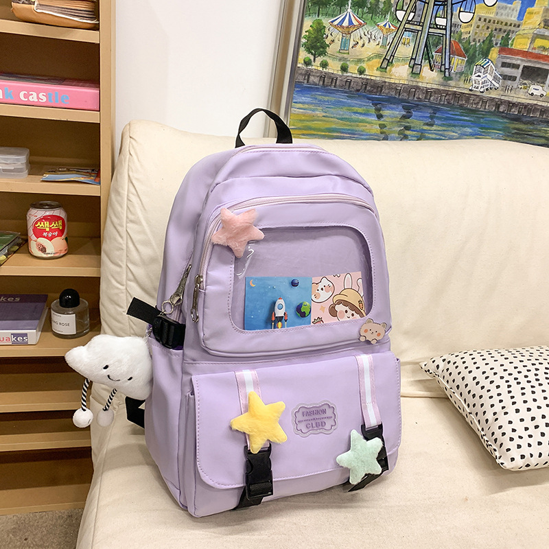 Mochilas escolares de moda bolsos de hombro para niñas estudiantes de primaria y secundaria sencillos paños transfronterizos ligeros bolsos de mano al por mayor bolsos de gran capacidad