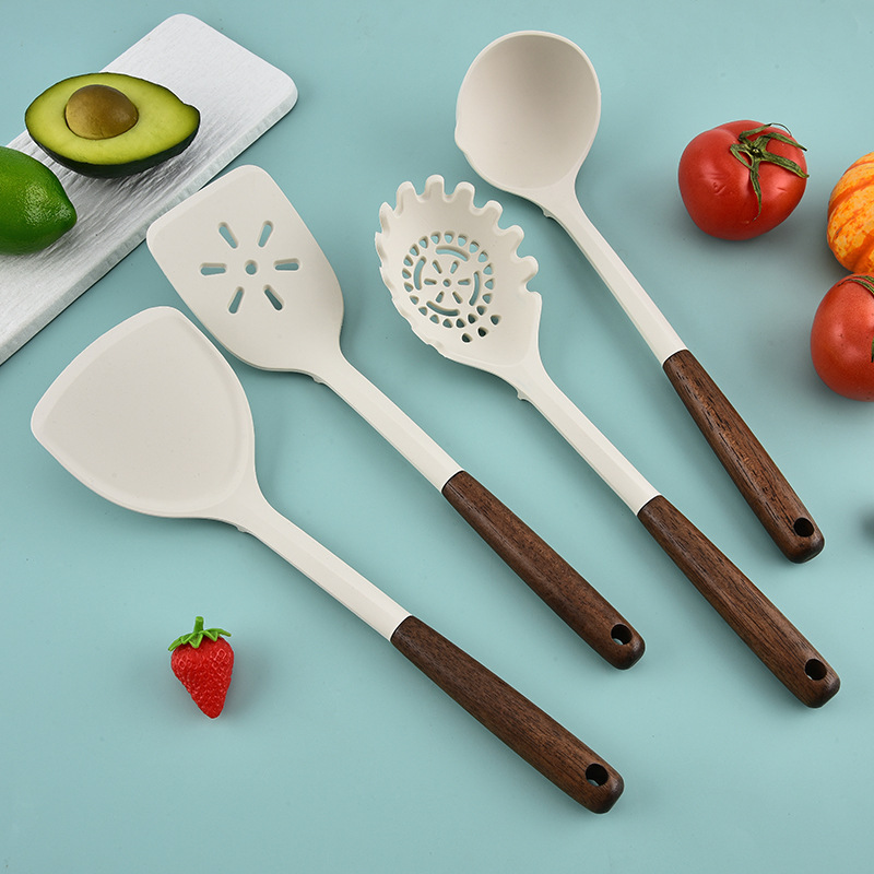 Fábrica directa de nuevo mango de madera de silicona cocina conjunto de venta caliente transfronteriza 28 piezas de conjunto de cocina antiadherente para paneles especiales