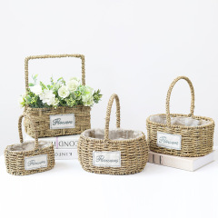 Rustic straw tote flower basket, floral arrangement basket for florists, rattan flower pot, gift-worthy home decor, and snack storage.