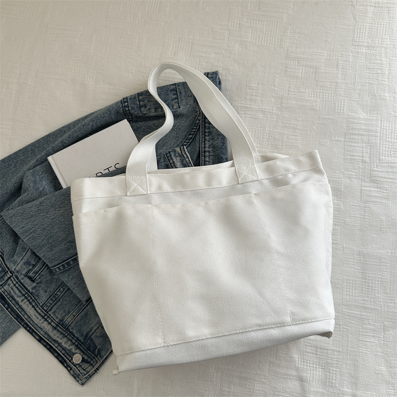 Invierno nuevo paquete de gran capacidad 2024, popular este año bolsas ociosas coreanas, bolsas de hombro de lecciones de reparación