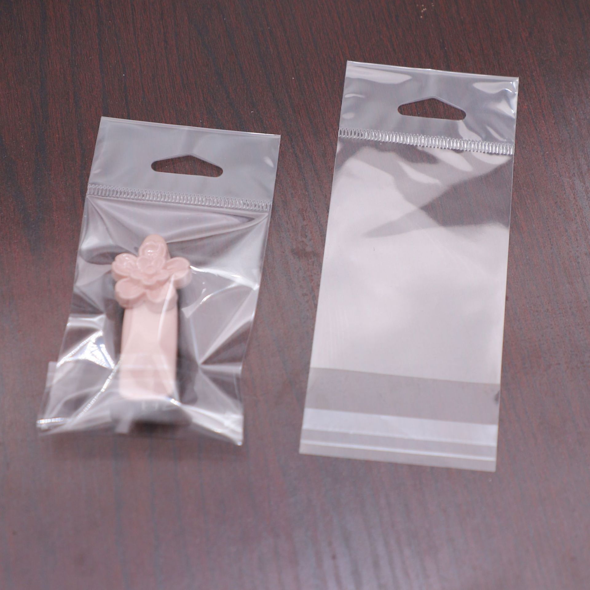 现货小号饰品袋指甲刀钥匙扣挂孔塑料袋印刷LOGO珠光卡头三角孔袋