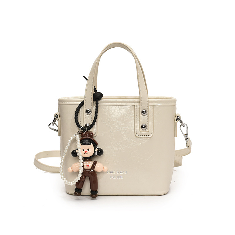 2025 nuevo nicho de moda bolso de cubo de mano para mujeres estilo coreano simple versátil bolso de hombro de moda mochila casual