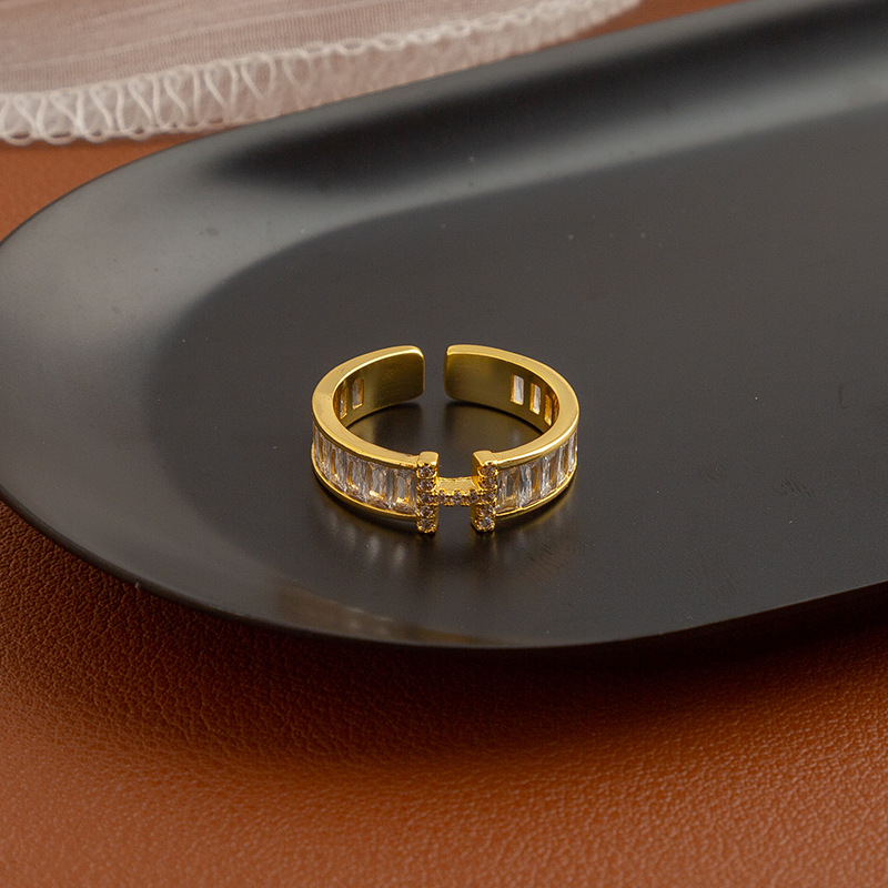 Golden ring with letters