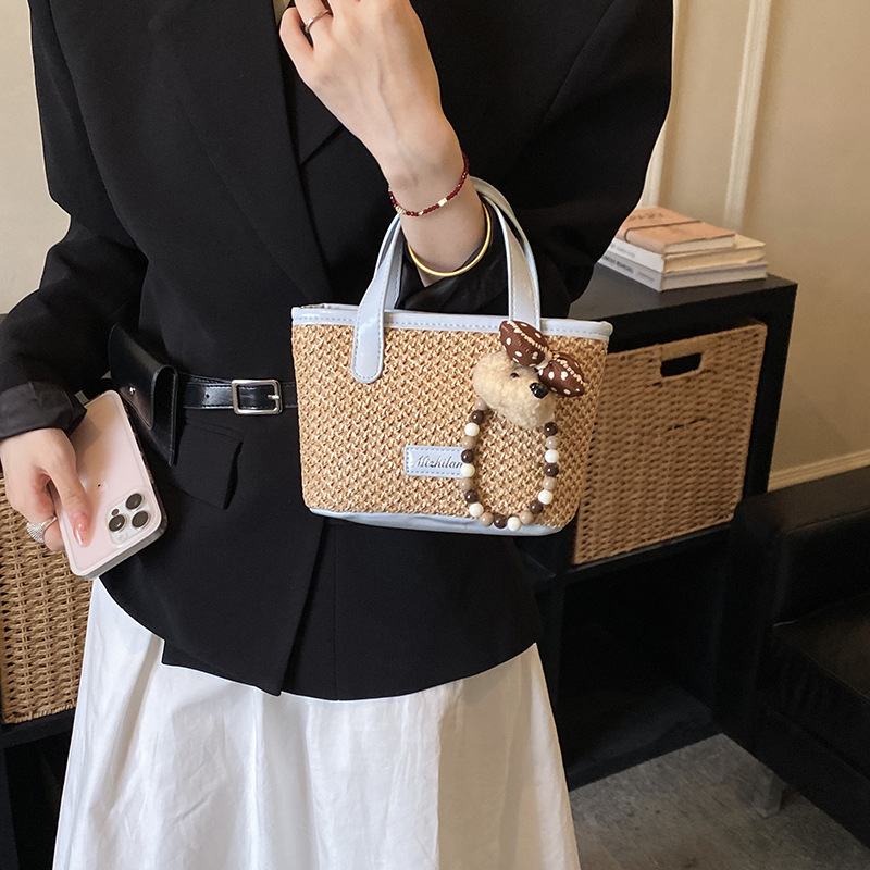 Bolsa de playa de moda coreana tejida, color extranjero, bolsa de hombro ligera y compacta para niños y niñas, nueva bolsa infantil transfronteriza.