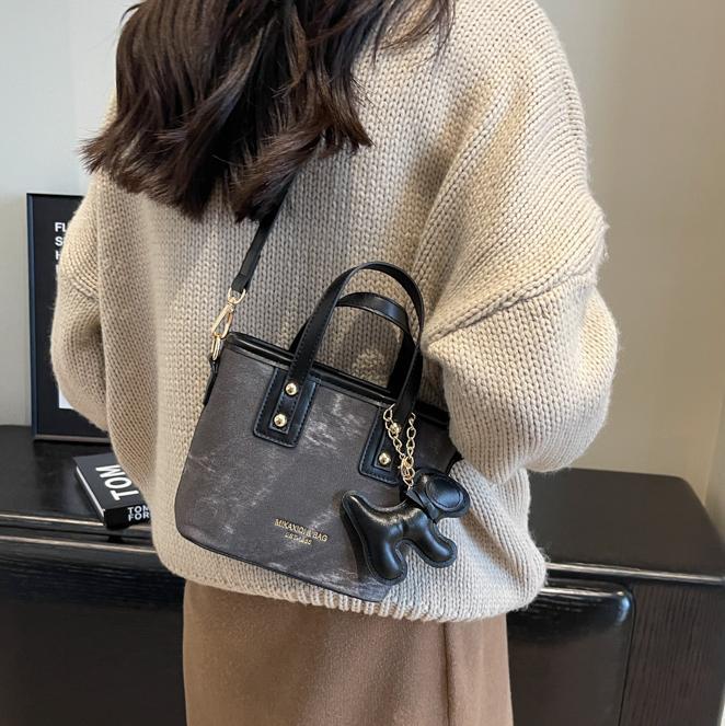 Mochila de alta textura de marea 2024 nuevo estilo versátil retro mochila de hombro de moda portátil bolso de cubo mujer