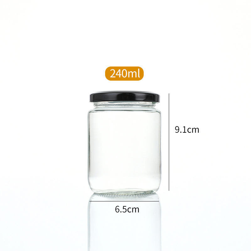 Botella de salsa redonda resistente a altas temperaturas sellada transparente resistente a altas temperaturas botella de melocotón amarillo enlatada botella de miel frutas botella de vidrio spot