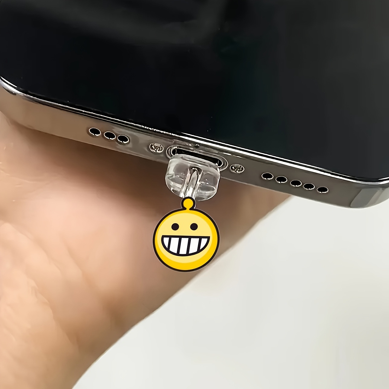 Nuevo acrílico transfronterizo plano hacia la sonrisa bolsa de emoticones enchufe de polvo de teléfono móvil