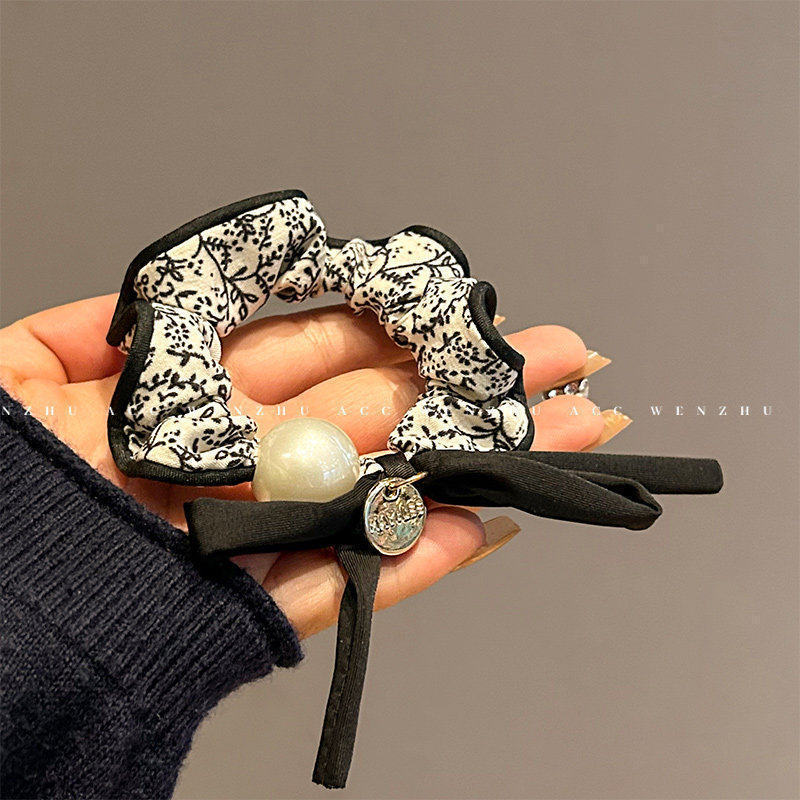 Cuerdas de cabello de viento pastoral pequeñas y altos valores faciales, anillo de cabello de intestino grande, sensación de una niña de banda de goma flácida, cuerdas de malla de banda de bola de cabeza