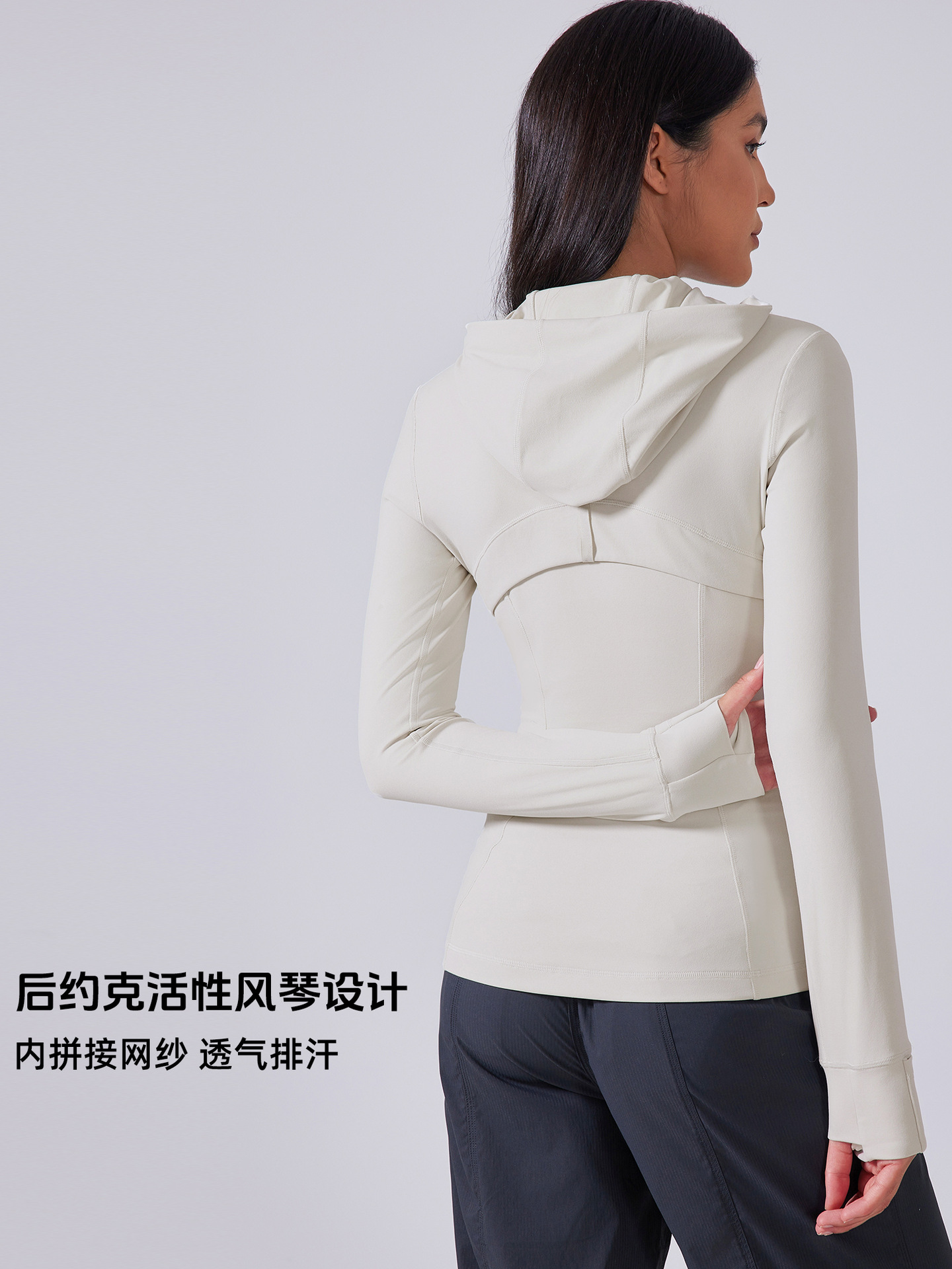 秋の新型ヨガ服の女性は帽子のファスナーの運動のコートを持っています。