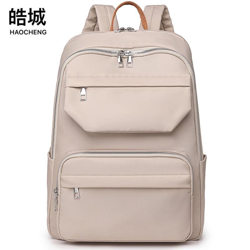 Venta directa de fábrica 2024 nuevo estilo coreano de las mujeres de nylon mochila simple todo partido Gran capacidad ordenador estudiante mochila