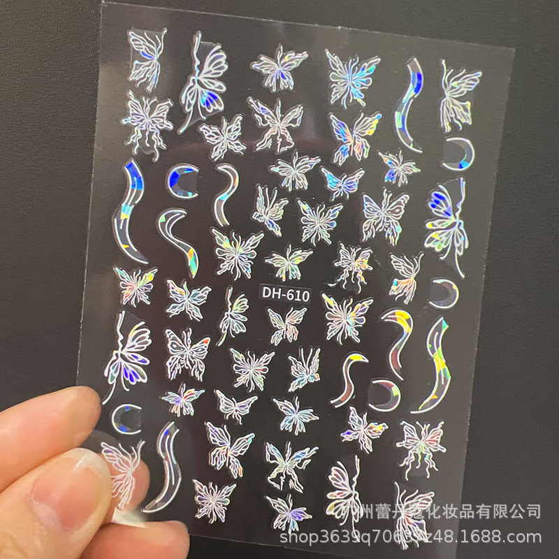 爆発的なネイルシールの上品な半透明な白い花びらの蝶のカラフルなオーロラガラスの破片には、ゴムの爪がついています|undefined