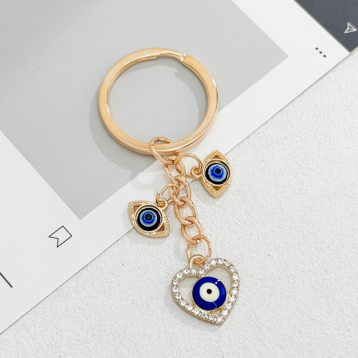 Cross-Border Hot Sale New Heart-Shaped Palm Water Drop Evil Eye Pendant Accessories Keychain Key Ring Manufacturer_voghion.com