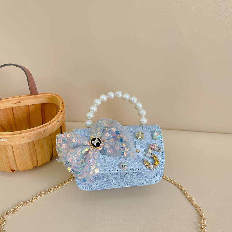 Primavera y verano nueva celebridad en línea bolso de los niños moda Chanel estilo princesa bolsa pequeña niña linda bolsa de mensajero portátil al por mayor