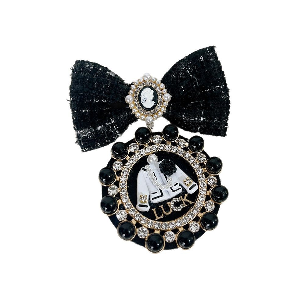 Spilla a fiocco con perle elegante accessorio versatile_voghion.com