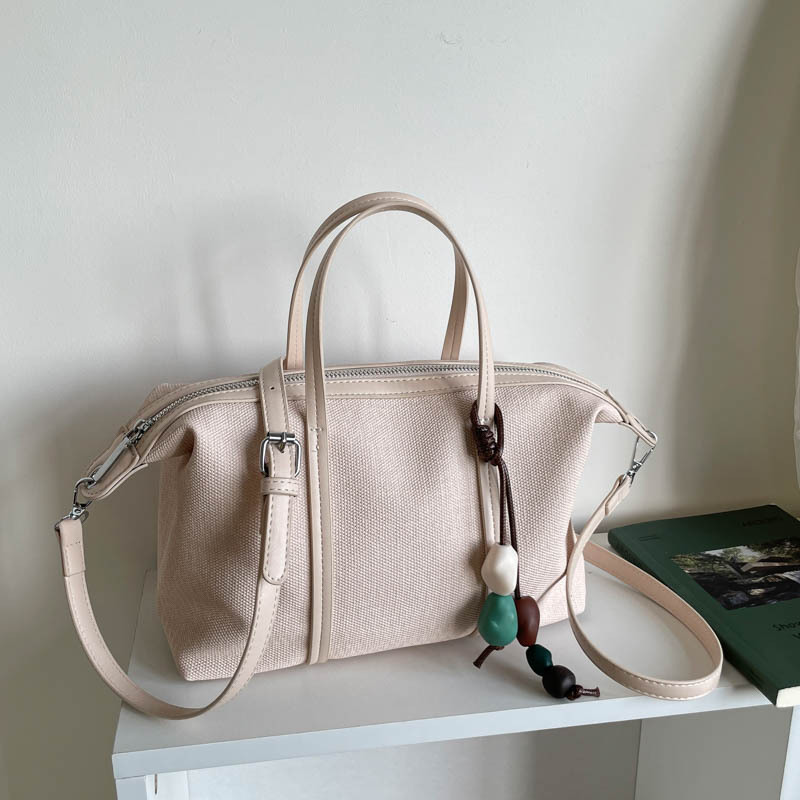 Bolsa de mano de gran capacidad de viaje coreano para mujeres 2026 nueva moda de verano simple bolsa de hombro retro