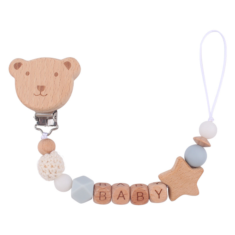 Nuevo bebé suministros de dibujos animados oso cabeza chupete clip calmante bebé nombre de madera mordedura chupete cadena anti-gota cadena